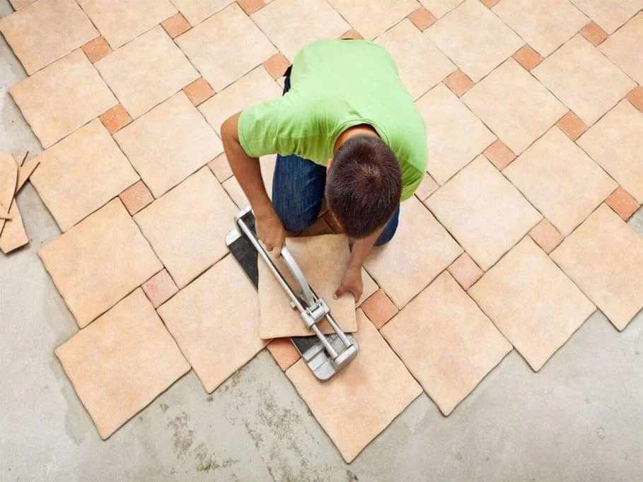 Daka Construction Technicians Installing New Laminate Flooring In Home During Flooring Installation Service
